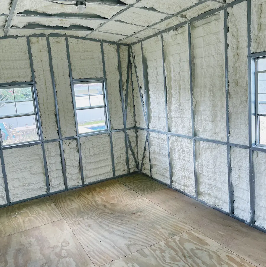 Closed-cell spray foam insulation applied to wall cavities in a residential project in Del Aire